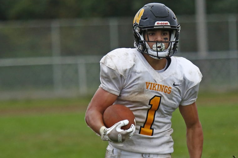 Archbishop Wood junior running back Tom Santiago rips off a big gain in a 27-7 win over Archbishop Ryan on Oct. 6.