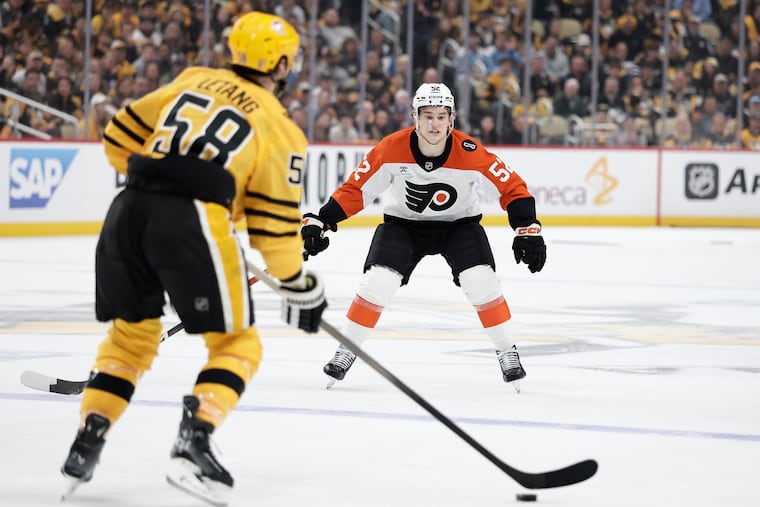 Flyers center Denver Barkey keeps an eye on Penguins defenseman Kris Letang as he handles the puck in Game 1.