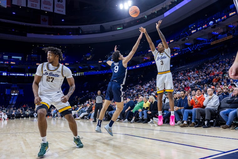 La Salle’s Eric Acker (3) shots a three-pointer against Penn State on Saturday.