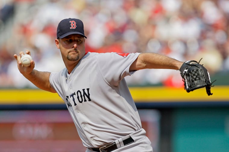 Boston Red Sox starter Tim Wakefield works in the second inning against the Atlanta Braves in Atlanta, June 27, 2009.