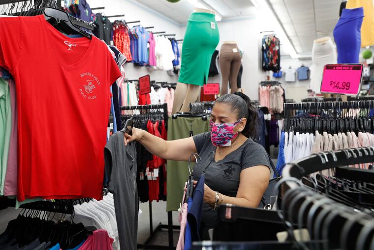 A woman shops for shirts in a MiniMax store in the Brooklyn borough of New York City.