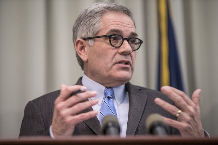 Philadelphia District Attorney Larry Krasner speaks at a news conference.