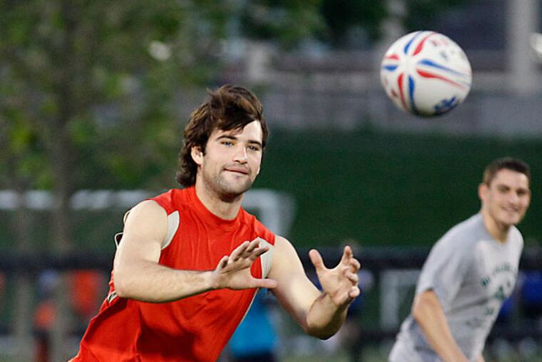 University of Pennsylvania rugby team member Billy Barro watches the the rugby ball during practice at Penn Park on Monday, May 20, 2013. (Yong Kim/Staff Photographer)