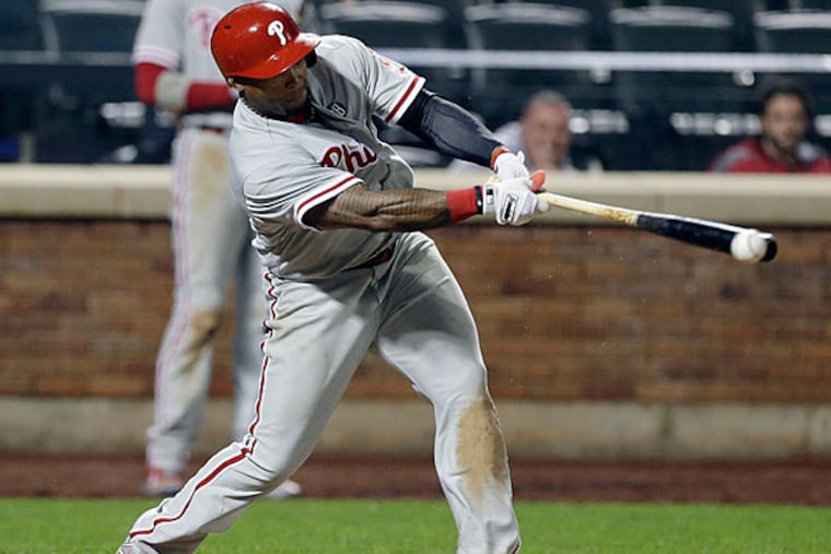 Marlon Byrd hits an RBI double during the eleventh inning of a baseball game against the New York Mets, Friday, May 9, 2014, in New York. (Frank Franklin II/AP)