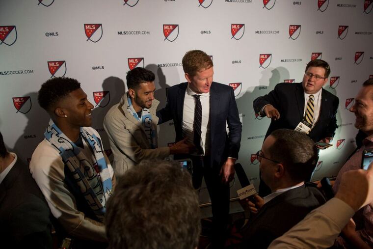 Philadelphia Union manager Jim Curtin (center) with new signings Matthew Real (next to Curtin) and Mark McKenzie (far left) at the 2018 Major League Soccer SuperDraft.