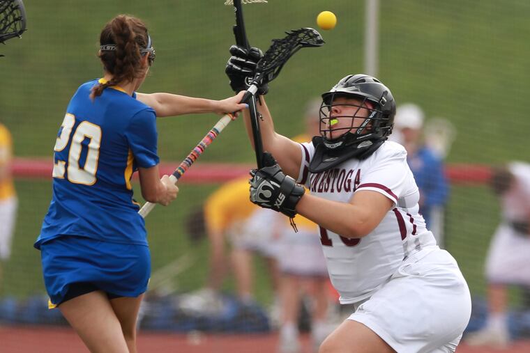 Olivia Little (left) shoots and scores past Anna Frascella last season.