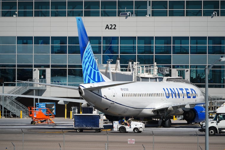 A United Airlines plane sits at a gate at Denver International Airport, March 20, 2026.