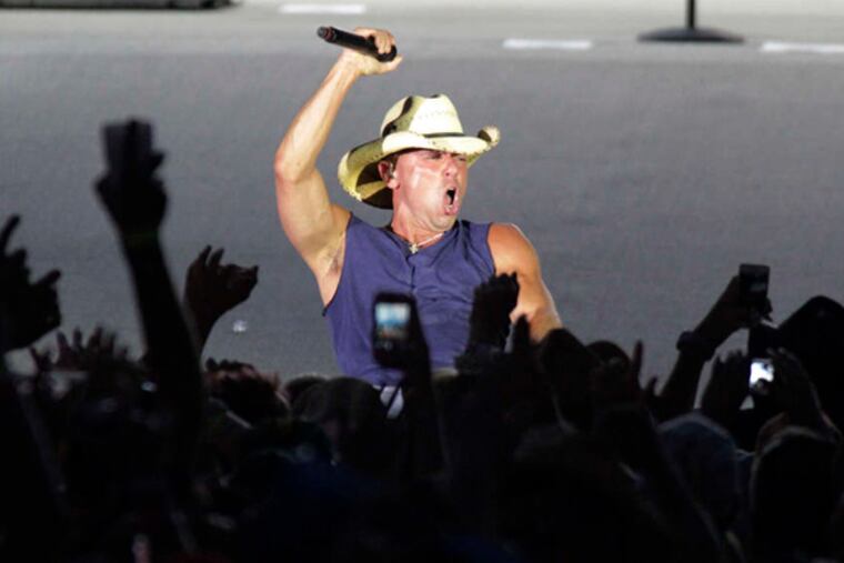 Country star Kenny Chesney performs at Lincoln Financial Field, part of his 17-stadium "No Shoes Nation"; tour. Saturday's concert was Chesney's sixth visit to the Linc.