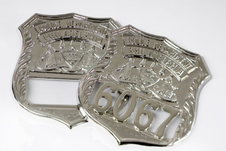 A Philadelphia police badge blank (left), and one with the numbers soldered onto a badge at Berben Insignia Company. (MICHAEL S. WIRTZ/Staff Photographer)