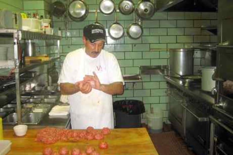 Basil DeLuca at work on his specialty, meatballs of consistent character. He fries them, 16 at a time, for a browned crust, tender interior; then, into the gravy. Villa di Roma, in the Italian Market since 1963, is opening a new production kitchen a couple of doors down.