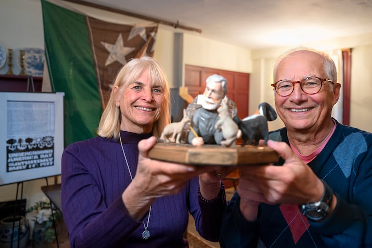 Board of trustees president Lenny Wagner (right) and vice president Linda Vizi pose with artwork made by Art Conant, a Haddonfield Memorial High School classmate of architect Malcolm Wells. Titled "A Meeting of the Underground Homeowners Association," the sculpture poked fun at Wells' advocacy of "earth-sheltered" buildings.