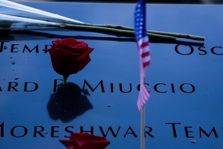 Flowers and American flags mark the south tower reflecting pool at the World Trade Center in Manhattan, Sept. 11, 2025. President Donald Trump originally intended to commemorate the 25th anniversary of Sept. 11 with remarks at ground zero, but the memorial’s organizers do not allow speeches. Trump changed his plans.