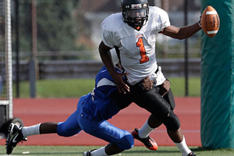 Furness' Sharif Smith is tackled for a safety during the 1st quarter at Northeast High School. (David Maialetti/Staff Photographer)