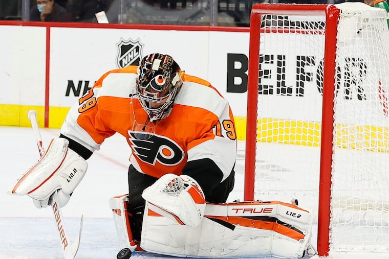 Flyers goaltender Carter Hart gets ready to cover the puck against the Boston Bruins in a preseason game Oct. 4. The Flyers won in OT, 2-1. Hart was extremely sharp in two preseason outings.