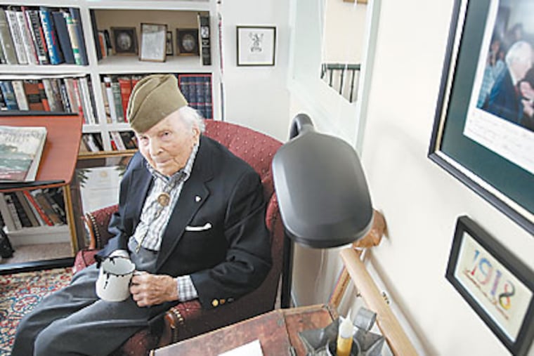 Frank Buckles, the last living American WWI veteran, wearing his WWI uniform hat and clutching the cup he used as a prisoner of the Japanese during WWII at his home in Charles Town, W.Va. on Jan. 27, 2009. (Laurence Kesterson / Staff Photographer)