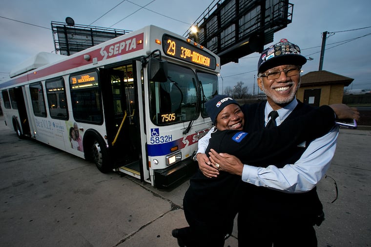SEPTA bus driver Sharon Morris with Eugene "Smitty" Smith at 33rd and Dickinson in south Philadelphia. Smith, 67, a SEPTA bus driver on the Rt 29 bus, is retiring at the end of 2014. ( ALEJANDRO A. ALVAREZ / STAFF PHOTOGRAPHER )