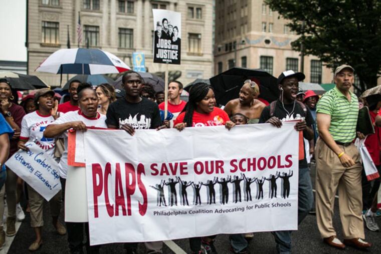 Over a thousand people march in support of public education outside of City Hall in Philadelphia on August 22, 2013. (Colin Kerrigan / Philly.com)