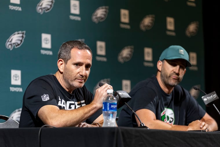 Eagles general manager Howie Roseman (left) and coach Nick Sirianni speaking after NFL roster cutdown day on Tuesday.