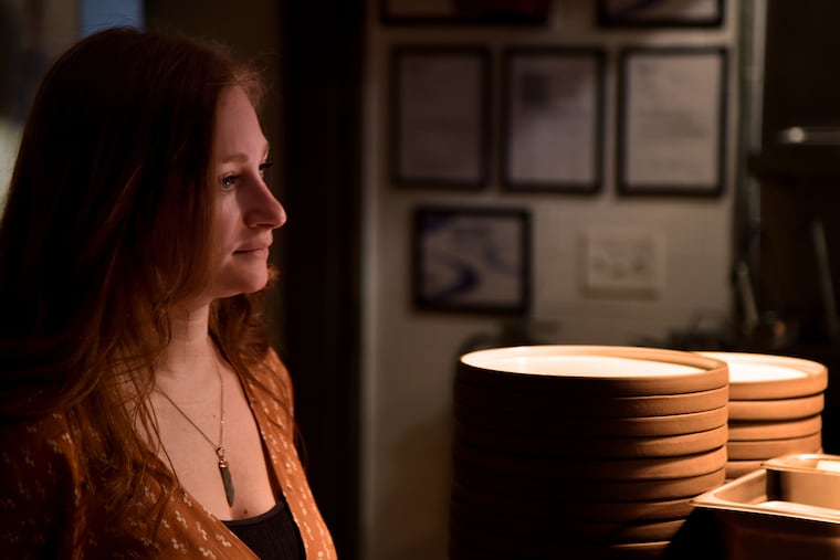 Co-owner and designer Amanda Rucker pauses between greeting diners at River Twice on East Passyunk Avenue in January.