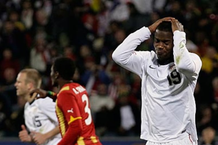 United States' Maurice Edu, right, reacts after a missed scoring opportunity during the U.S.'s 2-1 loss to Ghana. (AP Photo/Ivan Sekretarev)