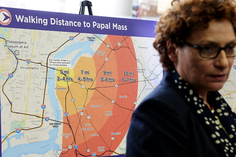 A map showing walking distances from New Jersey and times to get to the site of Pope Francis' visit to Philadelphia is displayed behind NJ Transit Executive Director Ronnie Hakim during a press conference. (TOM GRALISH/Staff Photographer)