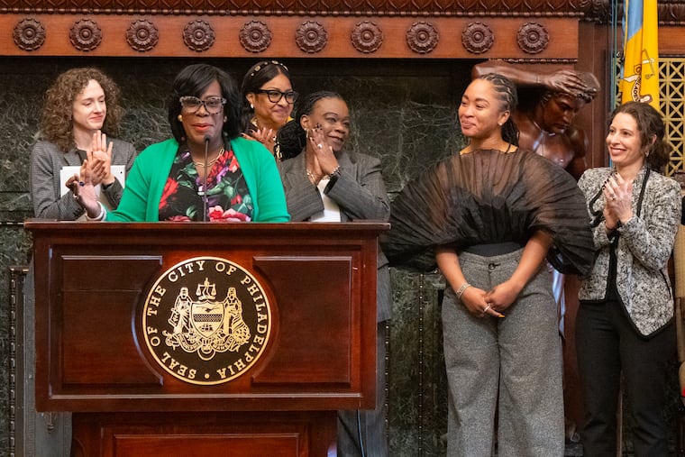 Mayor Cherelle Parker, at the podium, announces that Candi Jones, second from right, the first deputy director of the Office of Human Resources, will now serve as the city’s director of human resources, at City Hall, in Philadelphia, Monday, November 25, 2024.