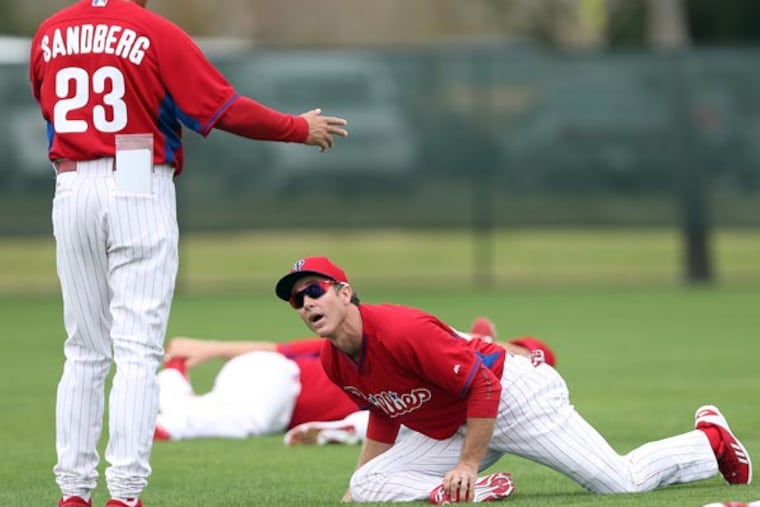 Phillies manager Ryne Sandberg and second baseman Chase Utley. (David Maialetti/Staff Photographer)