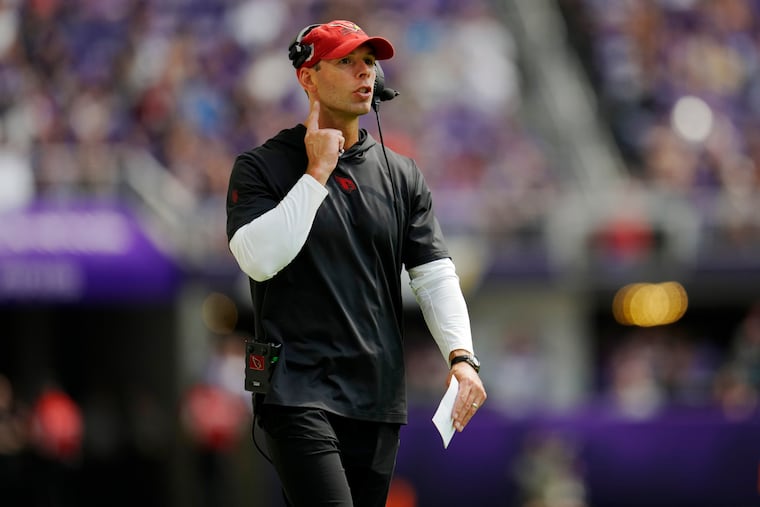 Arizona Cardinals head coach Jonathan Gannon makes a call during the first half of an NFL preseason football game against the Minnesota Vikings, Saturday, Aug. 26, 2023, in Minneapolis.
