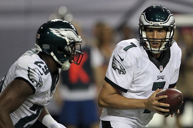 Sam Bradford looks over at teammate DeMarco Murray against the Atlanta Falcons.