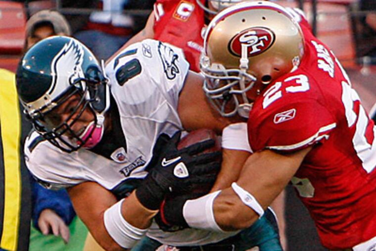 Brent Celek muscles his way into the end zone despite the efforts of 49ers safety Taylor Mays. (David Maialetti/Staff Photographer)