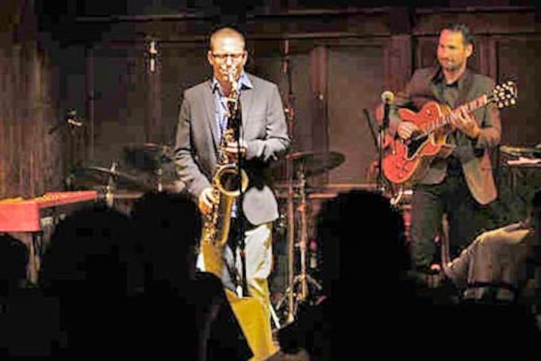 Sax player Victor North and guitarist Craig Ebner at Chris'. The owners agree that Chris' signature, mainstream sound is king and that experimental jazz is tough on a dinner-and-drinks audience. (Elizabeth Robertson / Staff Photographer)