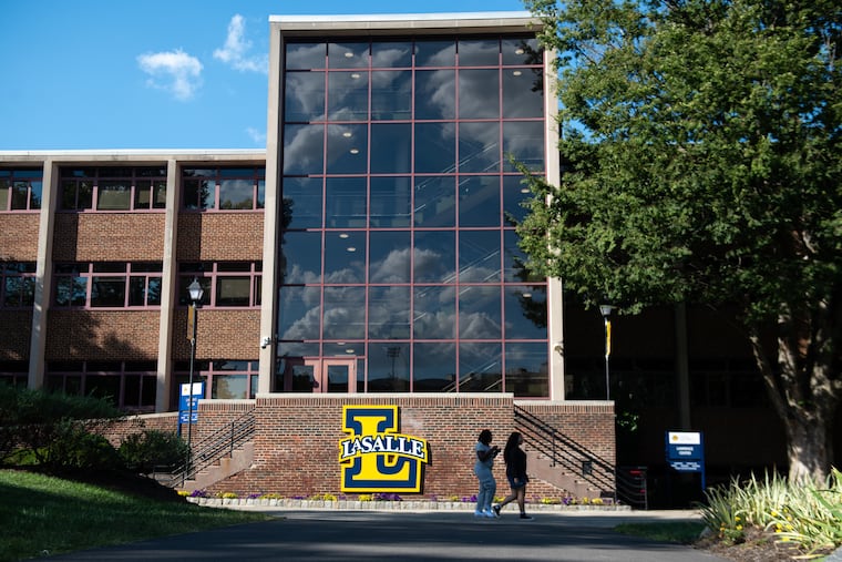 La Salle University students walk on campus in Philadelphia on Friday, Aug. 29. La Salle is one of a handful of universities in the region that is experiencing an uptick in enrollment.