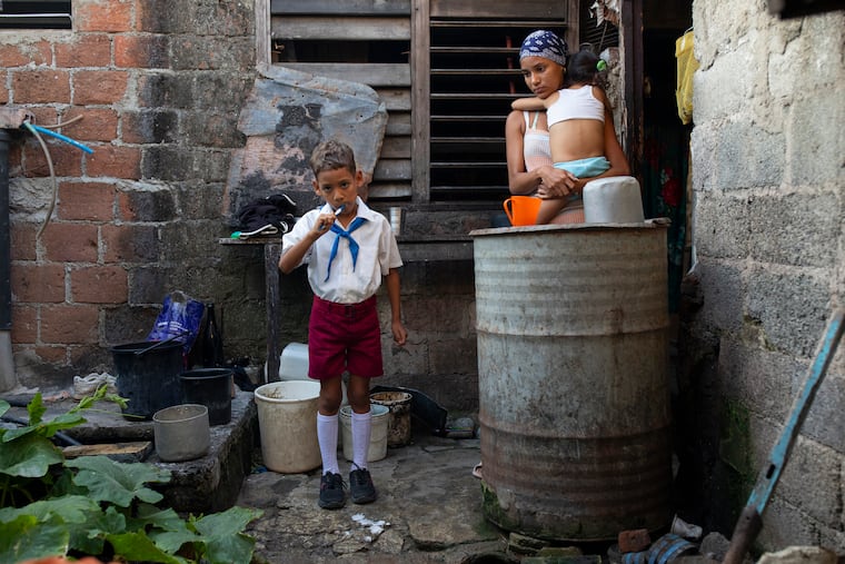 Analeidis Arias Matos gets her son, Alejandro, ready for school in Santiago, Cuba, on May 7, 2026. Cuba’s already struggling schools are ending the academic year early because of a crippling fuel shortage caused by the U.S. oil blockade.