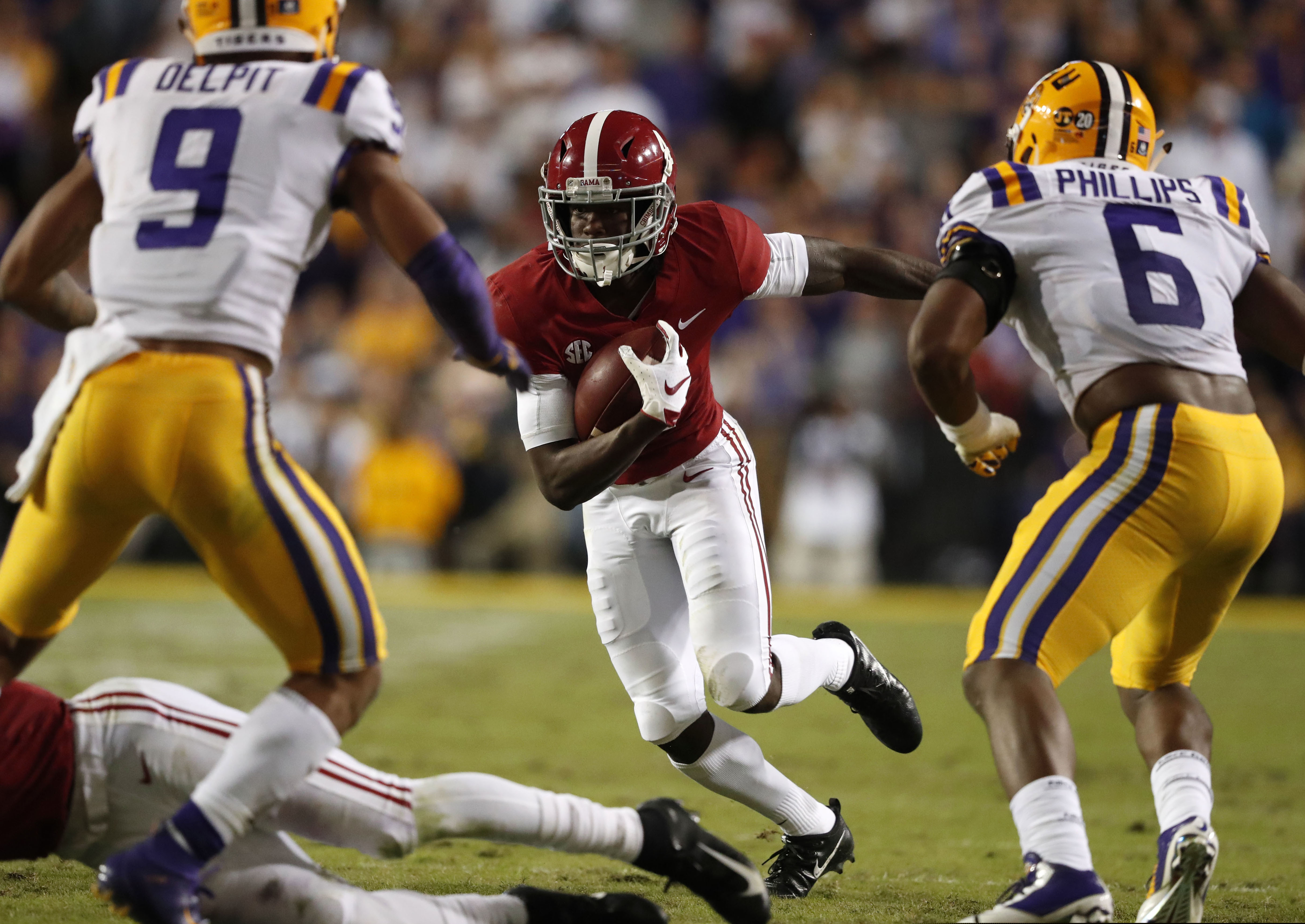 Alabama wide receiver Jerry Jeudy meets up with LSU defenders Grant Delpit and Jacob Phillips in last season's game in Baton Rouge, a 29-0 win for the Crimson Tide.