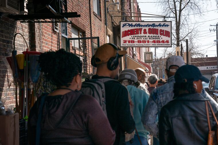 A line of people wait outside of the Philadelphia Gun and Archery Club in South Philadelphia last month.