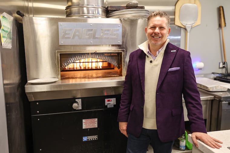 Christian Molnar poses for a portrait inside the cafeteria at the NovaCare Complex in Philadelphia on Friday, Jan. 12, 2024. Molnar coordinates catering from local chefs for the Eagles.