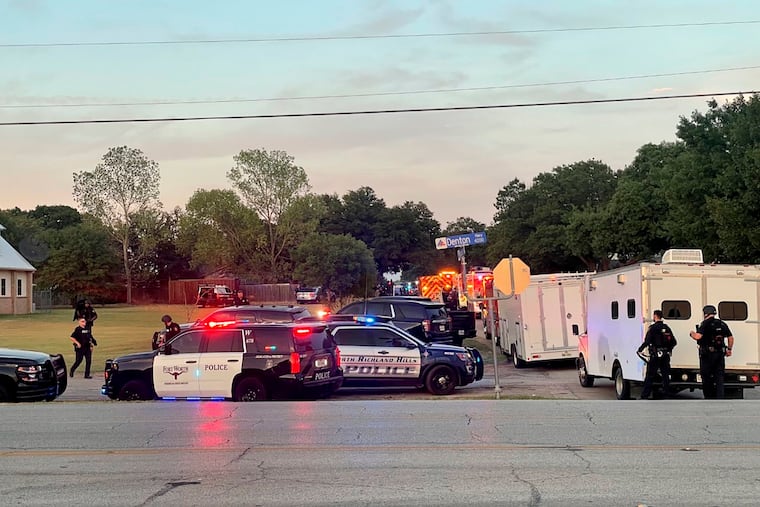 Law enforcement work the scene where multiple shots were fired in Haltom City, Texas, on Saturday, July 2.