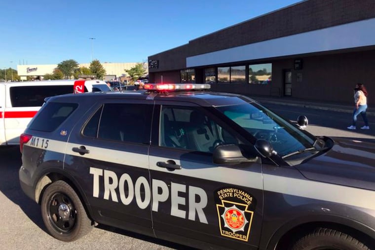 Pennsylvania State Police converge on the Lehigh Valley Mall after reports of a possible active shooter, Saturday, Sept. 19, 2020, in Whitehall, Pa. (Rick Kintzel/The Morning Call via AP)