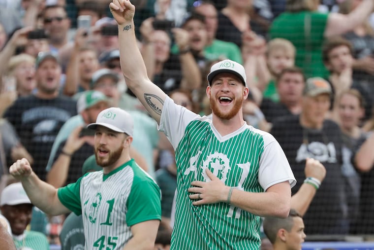 Eagles quarterback Carson Wentz cheers during a home run hitting contest during his charity softball game at Citizens Bank Park on Friday, May 31, 2019.