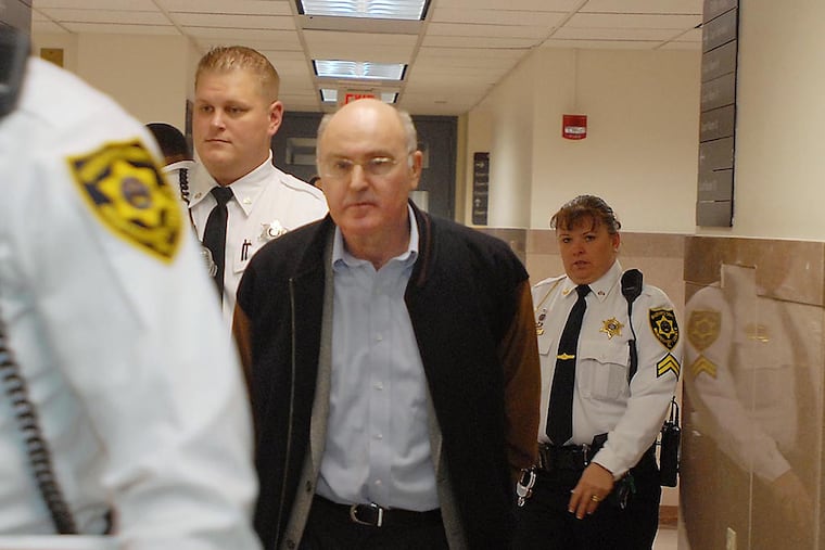 Ex-Penn professor Rafael Robb is led to his sentencing hearing in the Montgomery County Courtroom on November 19, 2008. (Ron Tarver / Staff Photographer)