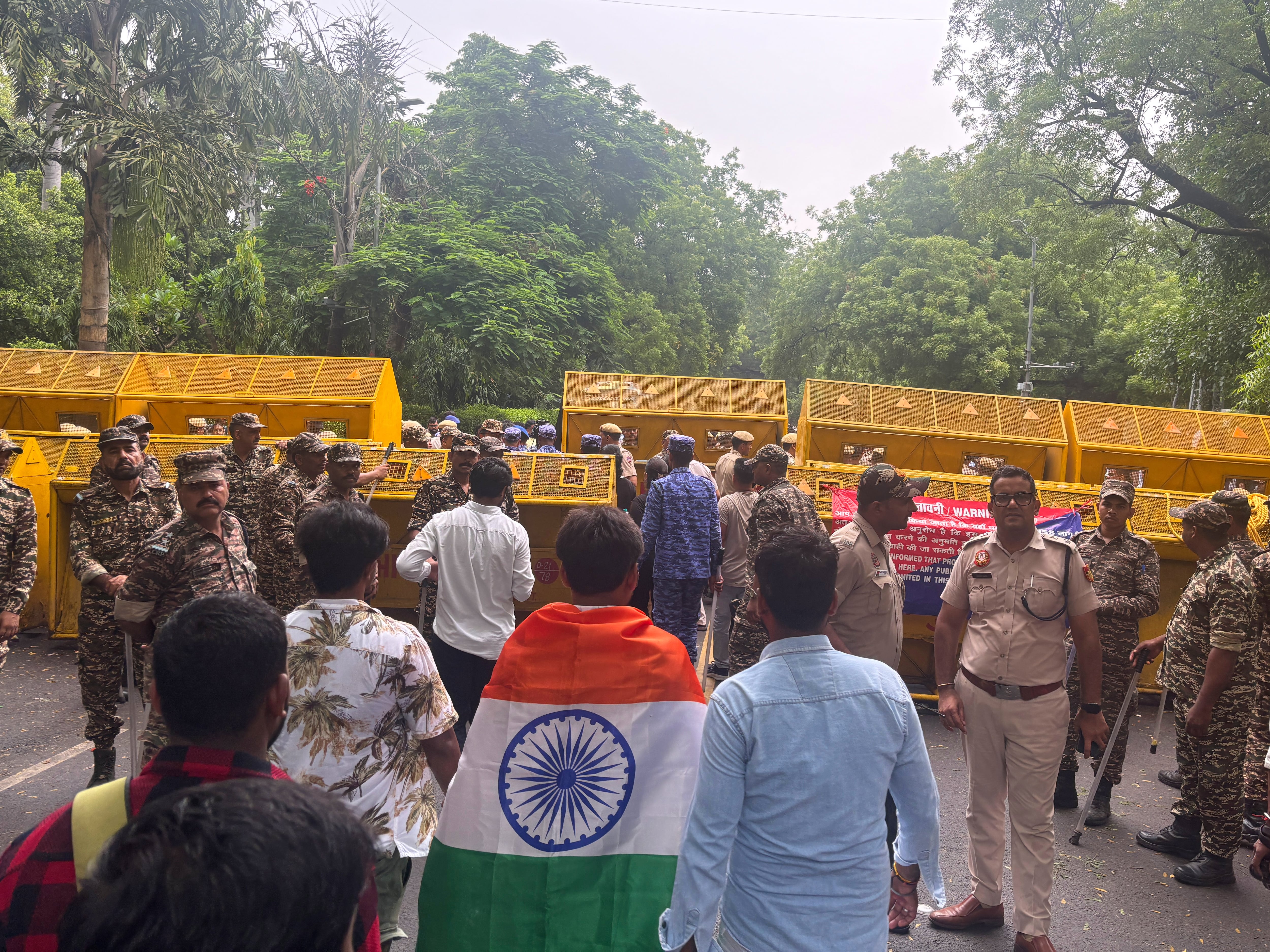 Police fire tear gas at India's Cockroach movement supporters as they attempt a march to Parliament
