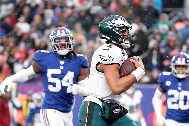 Philadelphia Eagles quarterback Jalen Hurts runs for a touchdown in the third quarter as New York Giants linebacker Jaylon Smith can’t catch him. Eagles play the Giants at MetLife Stadium on Sunday, Dec. 11, 2022, in East Rutherford, N.J.