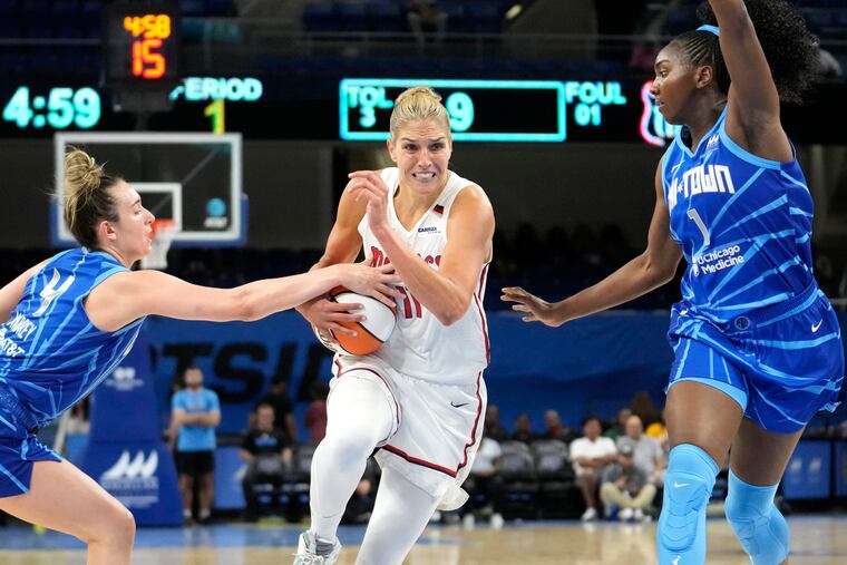 Washington Mystics star Elena Delle Donne driving to the basket between the Chicago Sky's Marina Mabrey (left) and Elizabeth Williams on June 22.