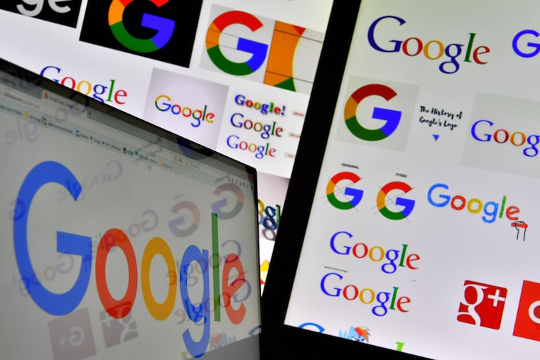 FILE photo shows logos of Google displayed on computers' screens.