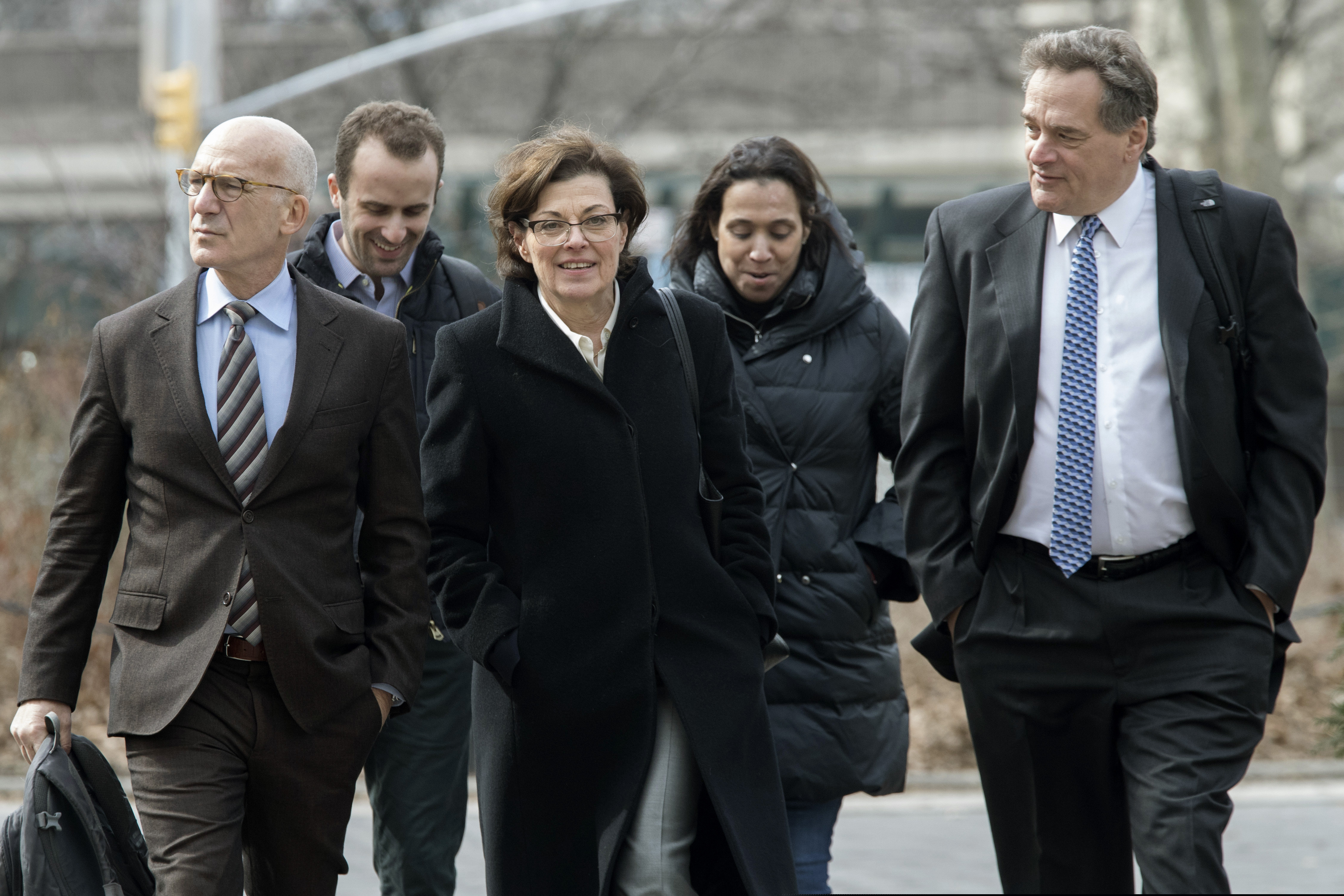 Nancy Salzman (center) arrives at Brooklyn federal court, Wednesday, March 13, 2019, in New York. Salzman, a co-founder of NXIVM, an embattled upstate New York self-help organization, pleaded guilty in a case featuring sensational claims that some followers became branded sex slaves.