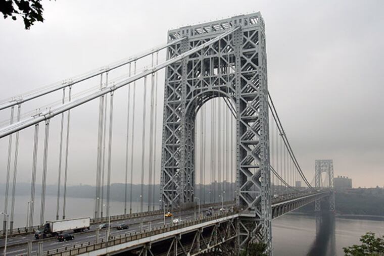 In a photograph made Monday, Sept. 2, 2013, in Fort Lee, N.J., traffic moves across the George Washington Bridge. A top aide to New Jersey Gov. Chris Christie is linked through emails and text messages to a seemingly deliberate plan to create traffic gridlock in a town at the base of the bridge after its mayor refused to endorse Christie for re-election. (AP Photo/Mel Evans)