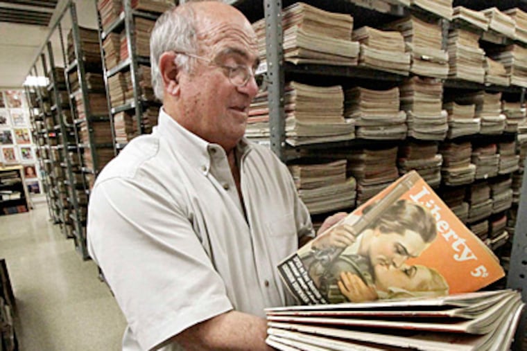 Fran DiBacco looks through a Liberty magazine from Dec. 3, 1938. "There's so much tremendous stuff in these magazines!" he says.