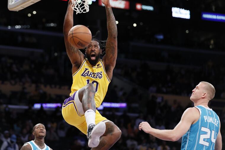 Los Angeles Lakers center DeAndre Jordan dunks over Charlotte Hornets center Mason Plumlee in the first quarter at Staples Center in Los Angeles on Monday, Nov. 8, 2021.