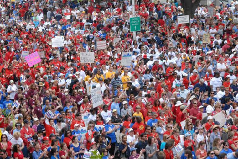 A crowd that state police estimated at 35,000 rallies outside the Statehouse in Trenton to protest Gov. Christie's veto Thursday of the so-called millionaire's tax and the cuts that his budget proposes.