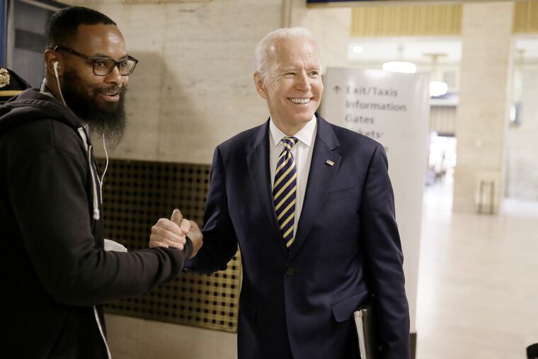 Democratic presidential candidate and former Vice President Joe Biden greets a few Amtrak employees as he arrives at 30th St. Station after attending a fundraiser in Philadelphia Thursday, April 25, 2019. (Elizabeth Robertson/The Philadelphia Inquirer via AP)